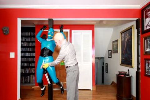 Living Latex Statue In Tormented In bondage
